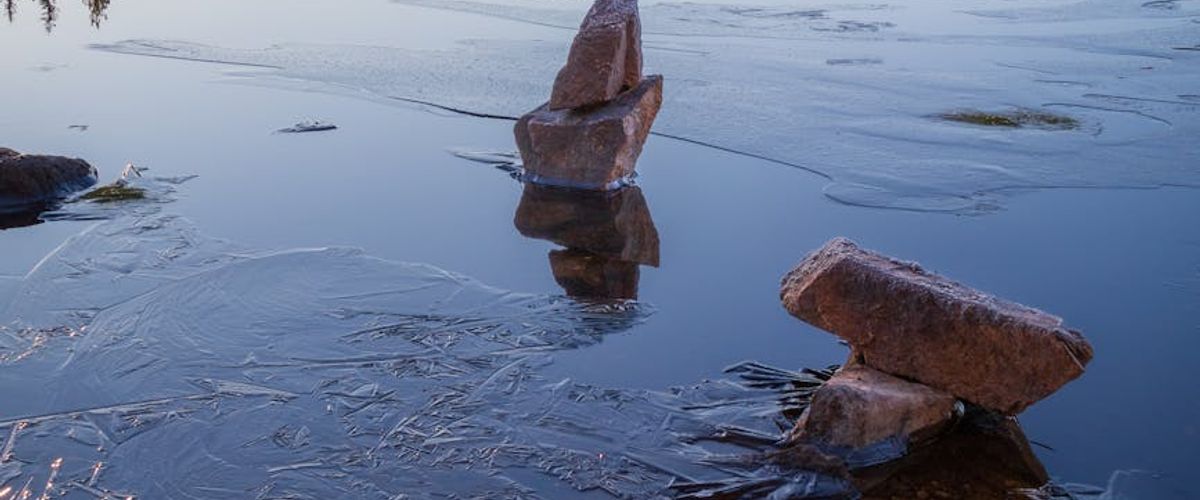 Wide panoramic abstract frozen lake reflecting morning light